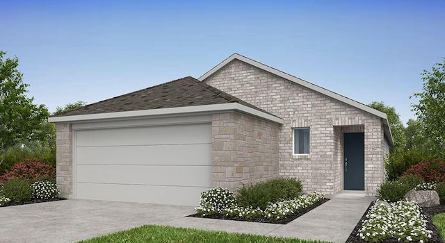 view of front of property featuring driveway, an attached garage, and stone siding