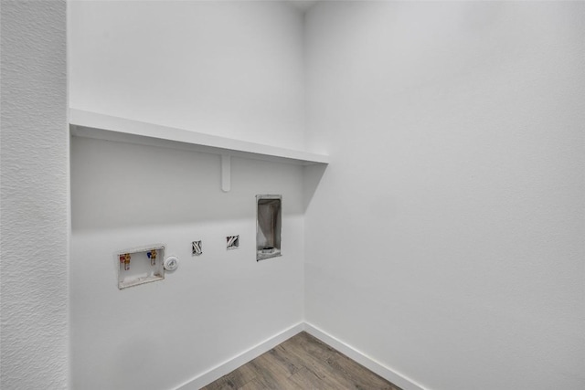 138 Blushing Dr, Cedar Creek, TX 78612 - washroom with hookup for a washing machine, dark wood-type flooring, baseboards, and gas dryer hookup