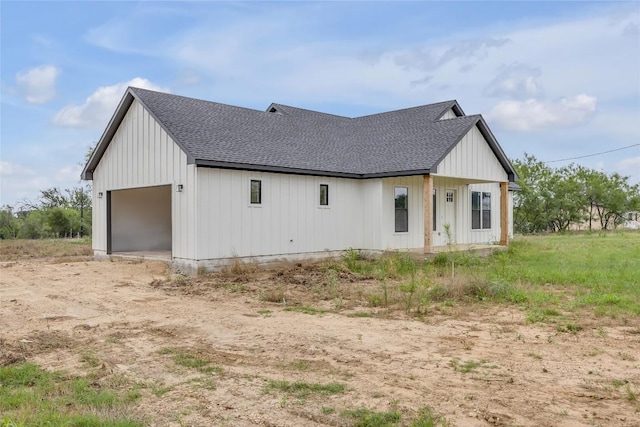 138 Blushing Dr, Cedar Creek, TX 78612 - view of front of home with roof with shingles, board and batten siding, and a garage