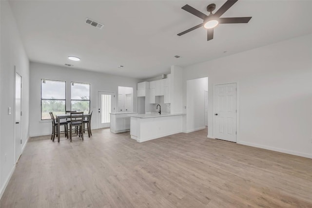 138 Blushing Dr, Cedar Creek, TX 78612 - living room with baseboards, light wood-style flooring, and ceiling fan