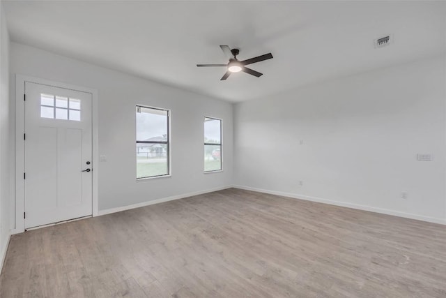 138 Blushing Dr, Cedar Creek, TX 78612 - entrance foyer with a ceiling fan, light wood-style flooring, and baseboards