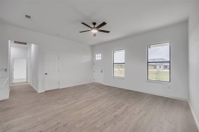 138 Blushing Dr, Cedar Creek, TX 78612 - spare room with a ceiling fan, light wood-type flooring, and baseboards