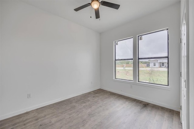138 Blushing Dr, Cedar Creek, TX 78612 - spare room featuring wood finished floors, baseboards, and a ceiling fan