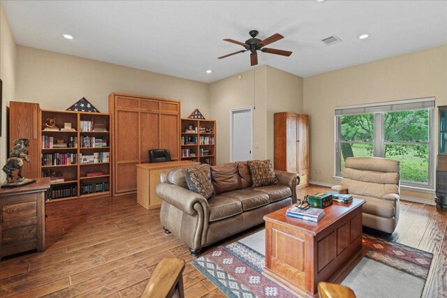 721 Deer Run, Wimberley, TX 78676 - living room with light wood finished floors, ceiling fan, recessed lighting, and an office area
