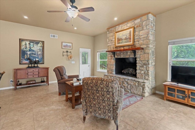 721 Deer Run, Wimberley, TX 78676 - living area featuring a ceiling fan, light tile patterned floors, a stone fireplace, and recessed lighting