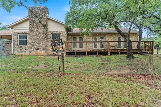 721 Deer Run, Wimberley, TX 78676 - rear view of house featuring a wooden deck, stone siding, a chimney, and french doors