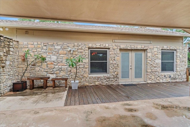 721 Deer Run, Wimberley, TX 78676 - entrance to property with stone siding, french doors, and a deck