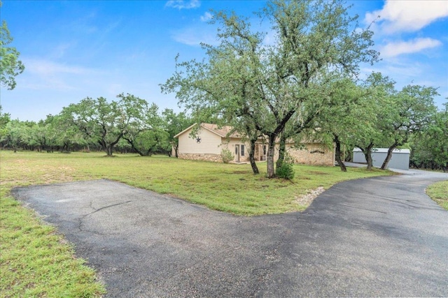 721 Deer Run, Wimberley, TX 78676 - view of front of house with a front lawn