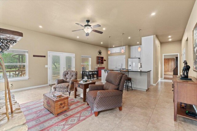 721 Deer Run, Wimberley, TX 78676 - living area featuring light tile patterned floors, recessed lighting, healthy amount of natural light, ceiling fan, and french doors