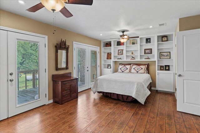 721 Deer Run, Wimberley, TX 78676 - bedroom featuring access to outside, wood finished floors, a ceiling fan, recessed lighting, and french doors