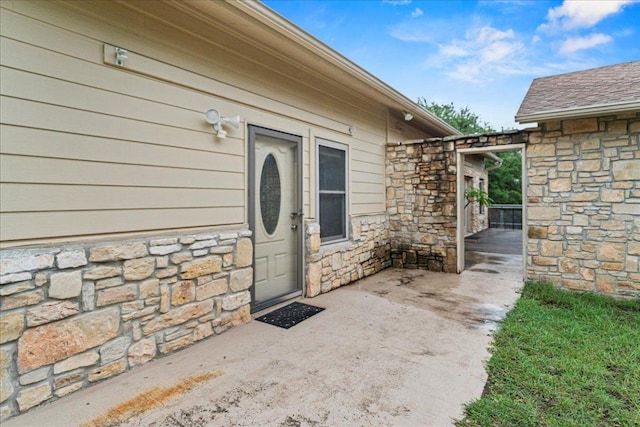 721 Deer Run, Wimberley, TX 78676 - entrance to property with stone siding and a patio