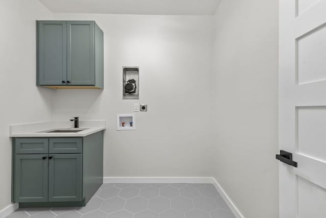 210 Las Colinas Dr, Georgetown, TX 78628 - laundry area featuring hookup for an electric dryer, cabinet space, washer hookup, and baseboards