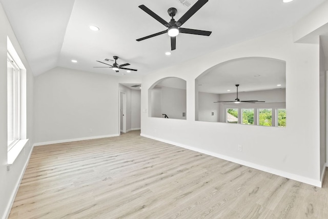 210 Las Colinas Dr, Georgetown, TX 78628 - unfurnished living room with ceiling fan, recessed lighting, wood finished floors, baseboards, and lofted ceiling