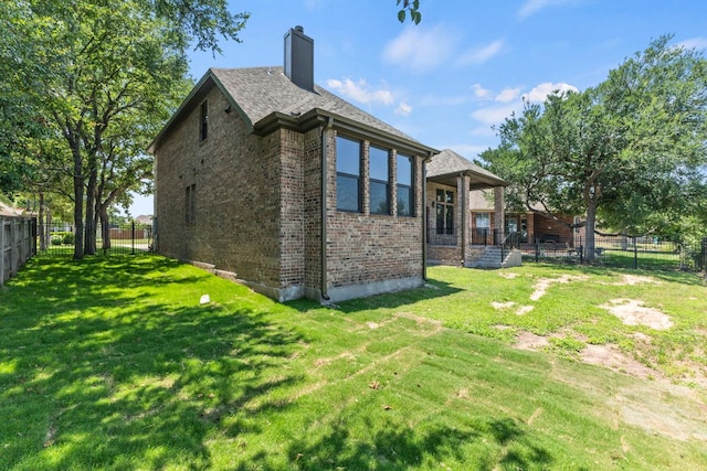 210 Las Colinas Dr, Georgetown, TX 78628 - rear view of property featuring brick siding and a chimney