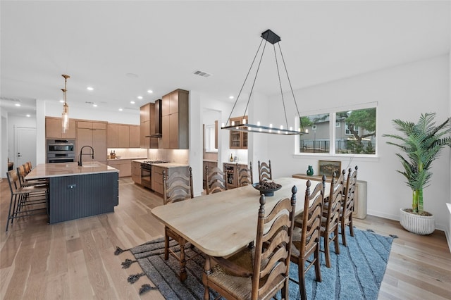 120 July Johnson Dr, Austin, TX 78737 - dining area featuring light wood-type flooring, recessed lighting, and baseboards
