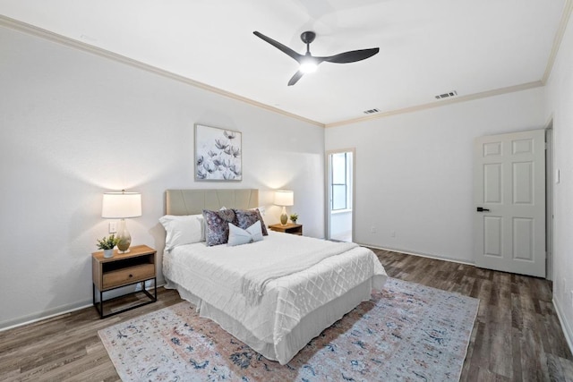 1706 Prairie Hen Cv, Austin, TX 78758 - bedroom featuring crown molding, wood finished floors, a ceiling fan, and baseboards