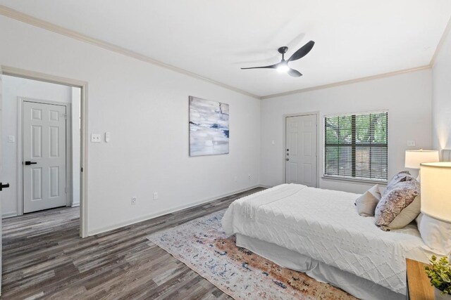 1706 Prairie Hen Cv, Austin, TX 78758 - bedroom with crown molding, wood finished floors, ceiling fan, and baseboards