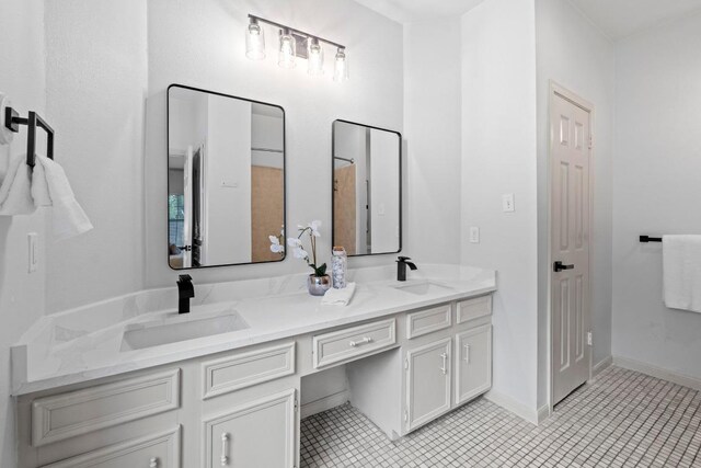 1706 Prairie Hen Cv, Austin, TX 78758 - full bath with double vanity and tile patterned flooring