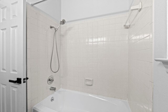 1706 Prairie Hen Cv, Austin, TX 78758 - full bathroom featuring washtub / shower combination