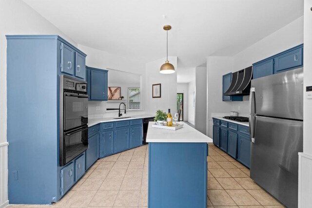 1706 Prairie Hen Cv, Austin, TX 78758 - kitchen with black appliances, blue cabinets, a center island, and light countertops