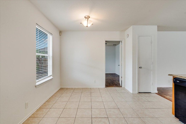 8520 Chick Pea Ln, Austin, TX 78748 - empty room with baseboards and light tile patterned floors