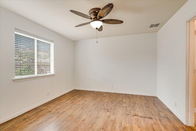 8520 Chick Pea Ln, Austin, TX 78748 - empty room with light wood-type flooring, ceiling fan, and baseboards