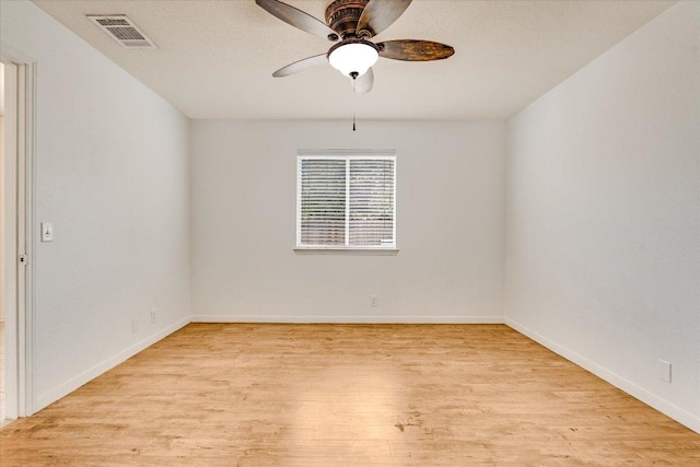 8520 Chick Pea Ln, Austin, TX 78748 - unfurnished room featuring light wood-style flooring, a ceiling fan, and baseboards