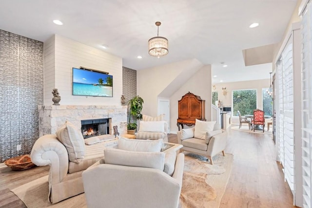 19506 Inverness Dr, Lakeway, TX 78669 - living area featuring wood finished floors, a stone fireplace, and recessed lighting