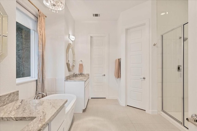 19506 Inverness Dr, Lakeway, TX 78669 - full bathroom featuring a shower stall, two vanities, and a freestanding tub
