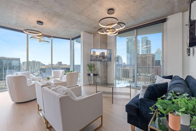 360 Nueces St Unit 1811, Austin, TX 78701 - living room featuring a chandelier, floor to ceiling windows, and wood finished floors