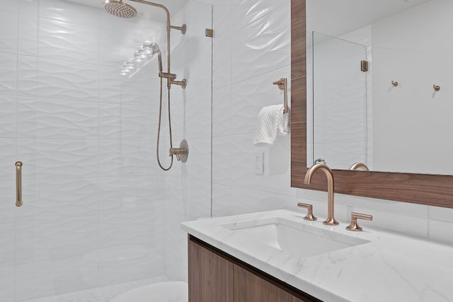 360 Nueces St Unit 1811, Austin, TX 78701 - bathroom featuring vanity and a shower stall