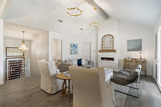 2449 Crosswind Dr, Lakeway, TX 78669 - living room featuring a chandelier, wood finished floors, beamed ceiling, a lit fireplace, and high vaulted ceiling