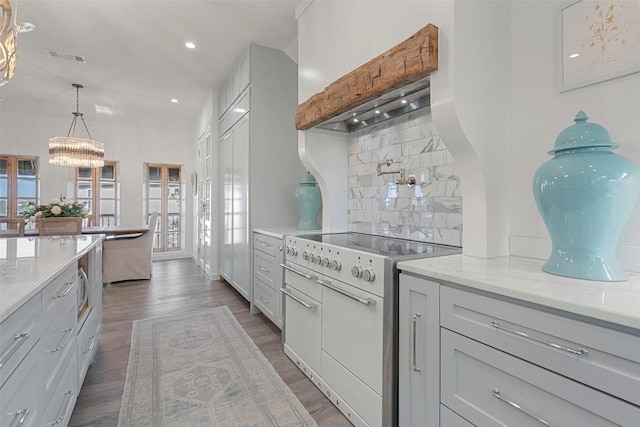 2449 Crosswind Dr, Lakeway, TX 78669 - kitchen featuring electric stove, tasteful backsplash, plenty of natural light, dark wood-type flooring, and recessed lighting