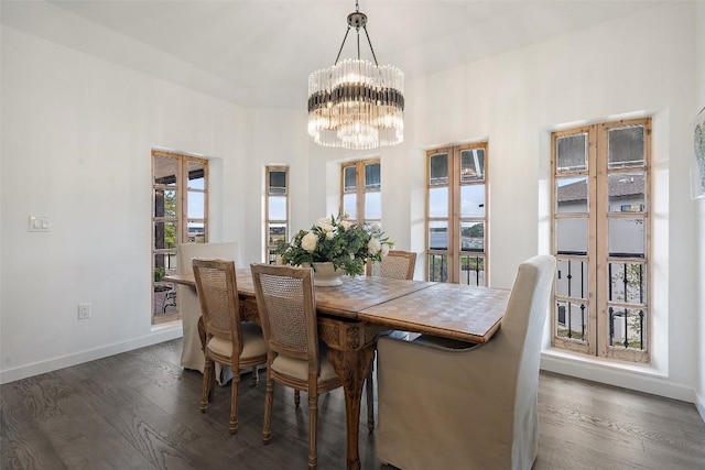 2449 Crosswind Dr, Lakeway, TX 78669 - dining area with a chandelier, wood finished floors, and baseboards
