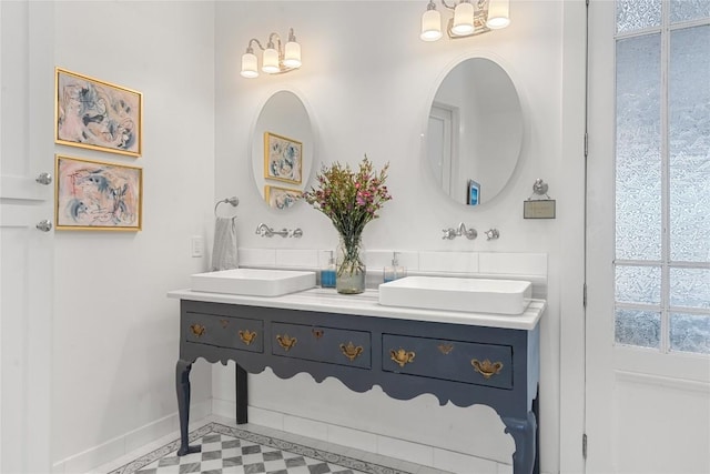 2449 Crosswind Dr, Lakeway, TX 78669 - full bath with double vanity and baseboards