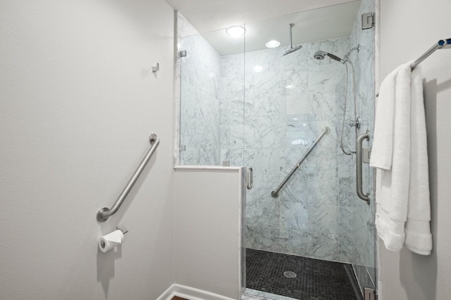 4116 Creek Ledge Unit 108, Austin, TX 78731 - bathroom featuring a marble finish shower and baseboards