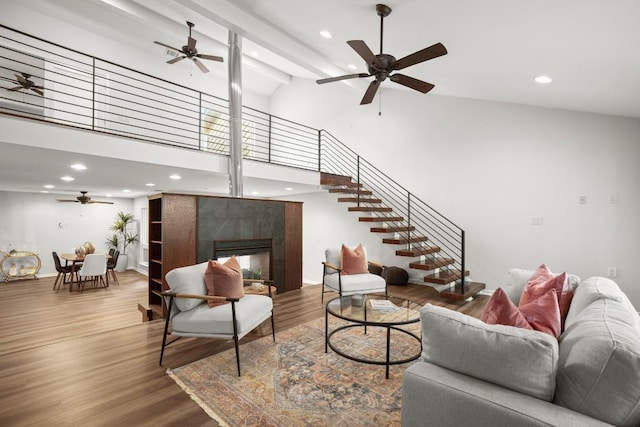 4116 Creek Ledge Unit 108, Austin, TX 78731 - living area with a ceiling fan, stairway, recessed lighting, wood finished floors, and high vaulted ceiling