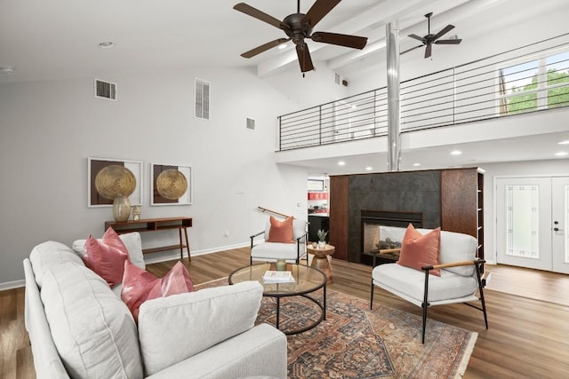 4116 Creek Ledge Unit 108, Austin, TX 78731 - living area with ceiling fan, high vaulted ceiling, baseboards, wood finished floors, and beamed ceiling