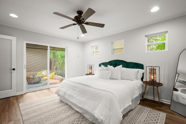 4116 Creek Ledge Unit 108, Austin, TX 78731 - bedroom with access to exterior, multiple windows, wood finished floors, recessed lighting, and baseboards