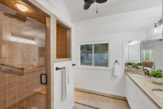 922 Challenger, Lakeway, TX 78734 - full bath with double vanity, a stall shower, tile patterned flooring, inlaid floor details, and a ceiling fan