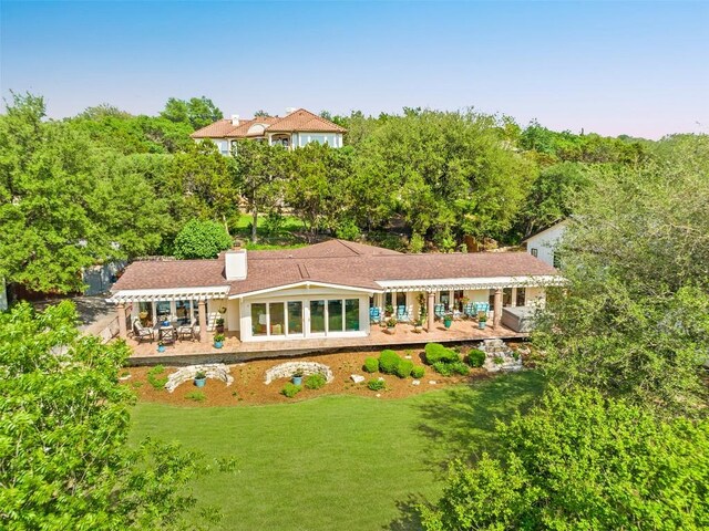 922 Challenger, Lakeway, TX 78734 - rear view of house with a patio area, a yard, and a chimney