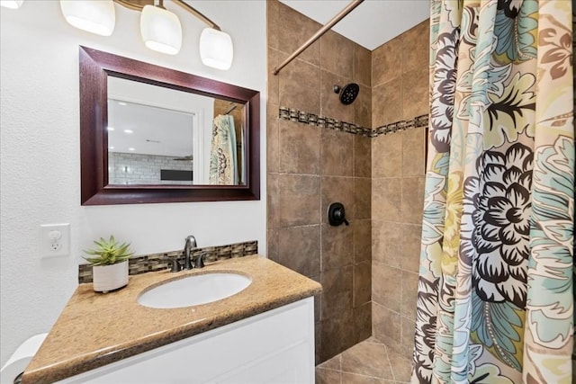 922 Challenger, Lakeway, TX 78734 - full bathroom featuring vanity and a tile shower