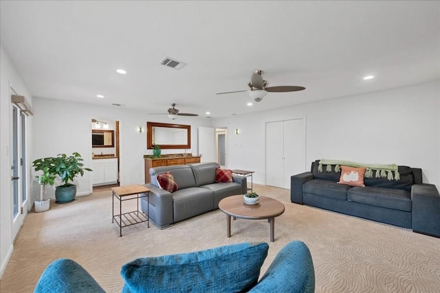 922 Challenger, Lakeway, TX 78734 - living room featuring light colored carpet, a ceiling fan, and recessed lighting