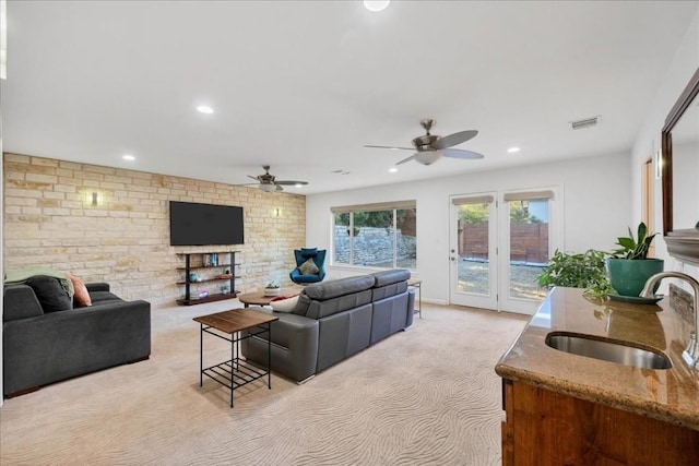 922 Challenger, Lakeway, TX 78734 - living room with light colored carpet, ceiling fan, and recessed lighting