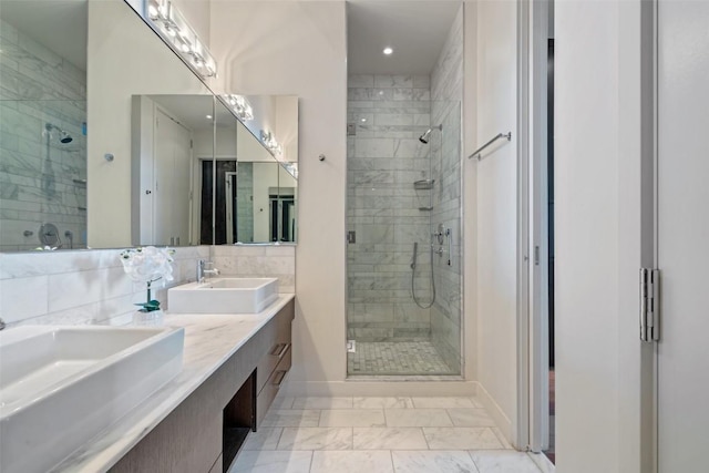 210 Lavaca St Unit 2203, Austin, TX 78701 - bathroom with marble finish flooring, a shower stall, double vanity, and recessed lighting