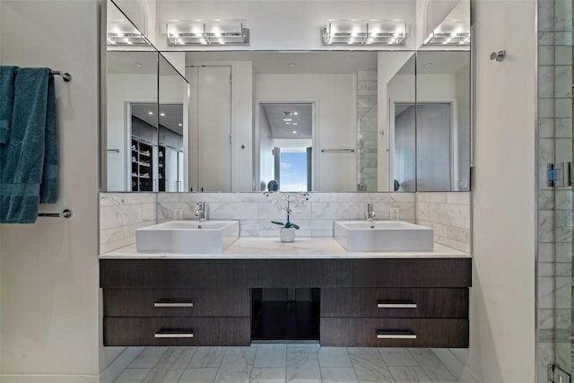 210 Lavaca St Unit 2203, Austin, TX 78701 - full bathroom featuring double vanity, marble finish floors, backsplash, and a shower with door