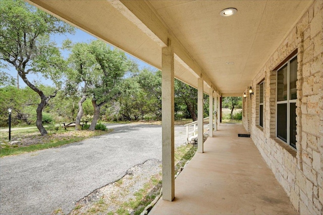 9438 Circle Dr, Austin, TX 78736 - porch featuring view of scattered trees