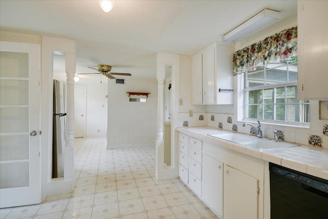 9438 Circle Dr, Austin, TX 78736 - kitchen with dishwasher, a sink, a ceiling fan, light flooring, and tile counters