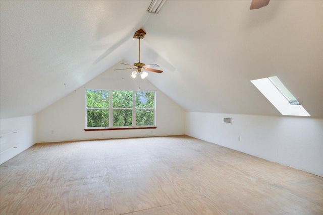 9438 Circle Dr, Austin, TX 78736 - bonus room with a ceiling fan, lofted ceiling, and a skylight