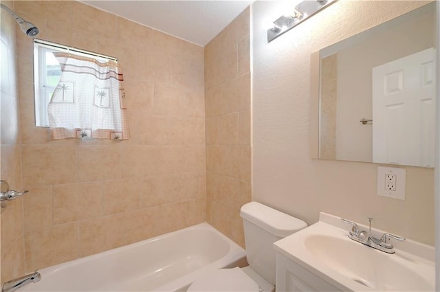 1007 Johnson St, Lockhart, TX 78644 - full bath with vanity, washtub / shower combination, and toilet